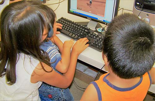 kids playing on computer